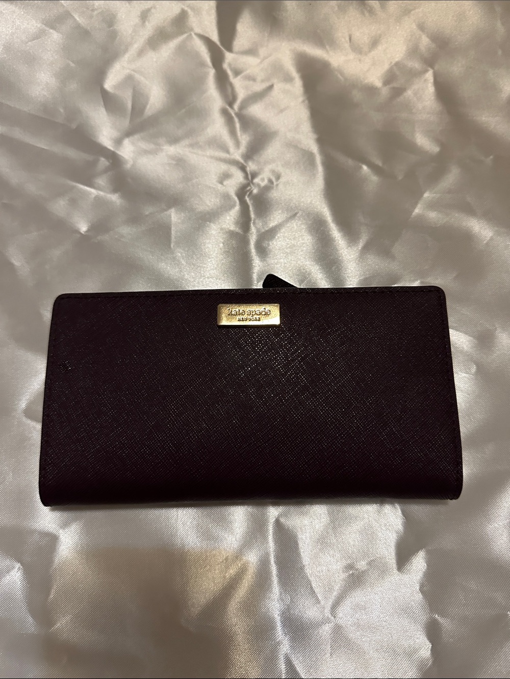 kate spade plum bifold  wallet with gold plaque
